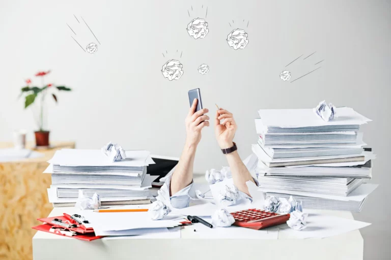 conceptual-image-collage-about-many-crumpled-papers-desk-stressed-male-workplace-2048x1365